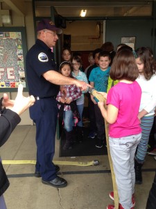 Fir Grove Elementary students receive visitors from Roseburg Fire Department and Douglas County Fire District No. 2.