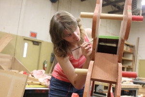 A Roseburg High student does detail work on a rocking horse that started as a drafting project and became part of a CTE woodshop class. 